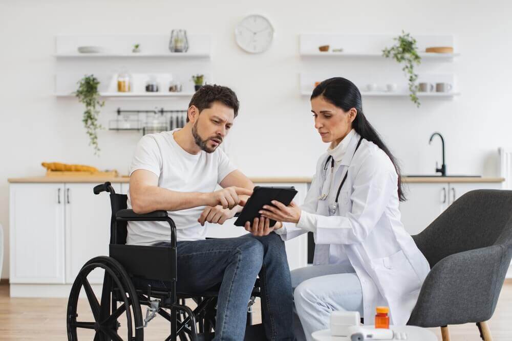 Brunette caucasian female doctor checking up condition of bearded male patient at home.